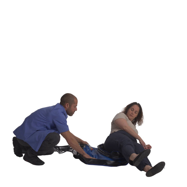Person on the floor positioning the FloorRiser behind them